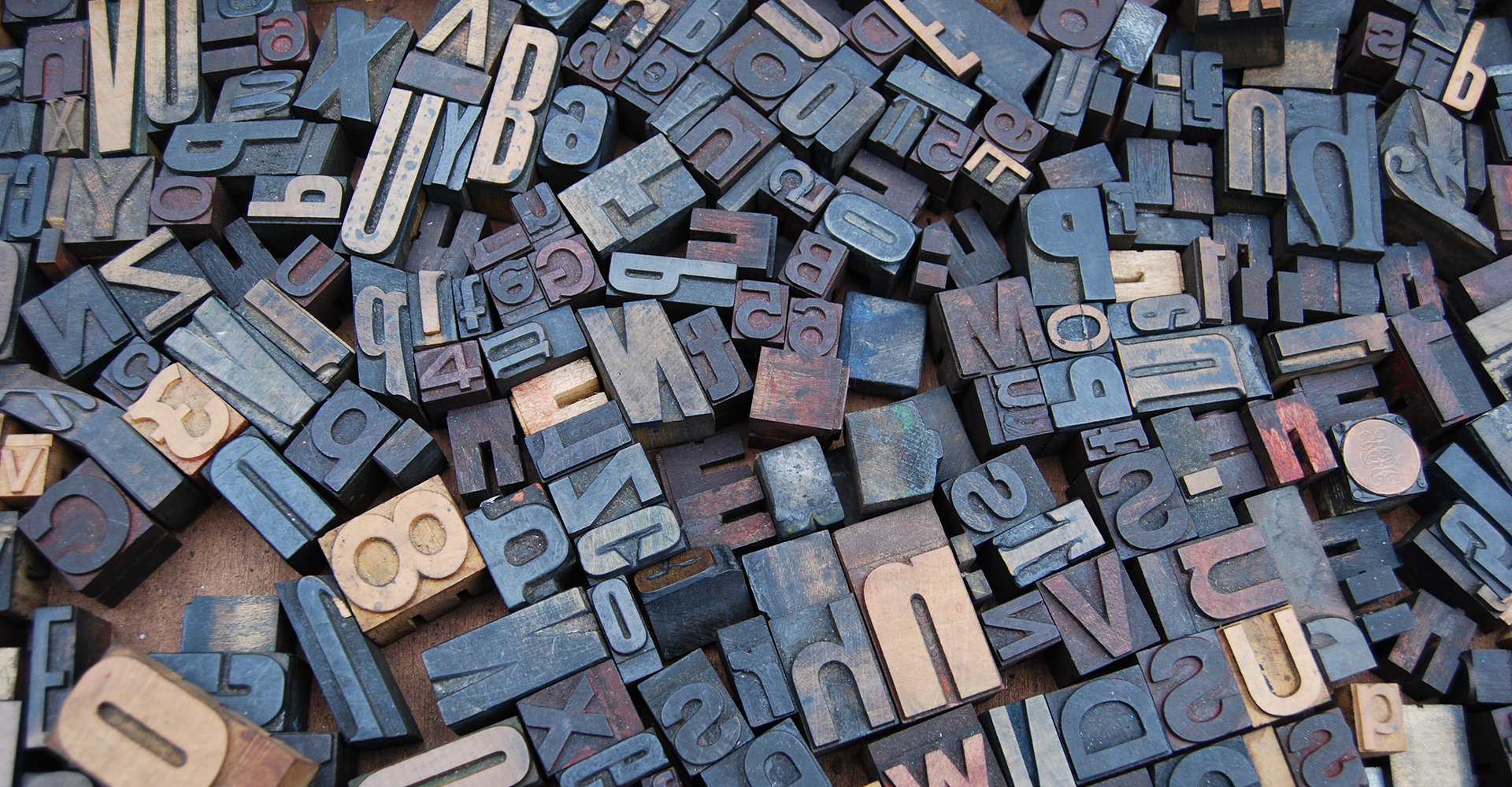 Photo of old school printing press letters