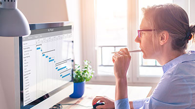 Photo of a person looking at a computer screen